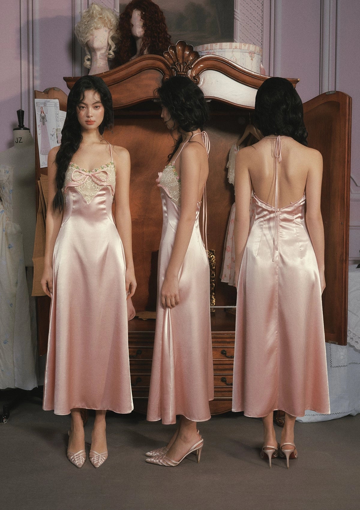 Front, side and back views of Vedress satin halter dress with a lace bodice panel, neck ties and a low open back.
